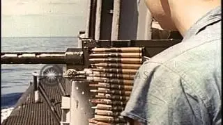 A machine gun aboard a ship being fired at underwater mines in the Pacific Ocean ...HD Stock Footage