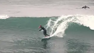 skip mccullough surfing his home break in san diego. HD.