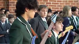 School of Rock performance of 'Long way to the top' at Trinity's Quad Assembly