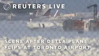 LIVE: Scene after plane flips on landing at Toronto airport