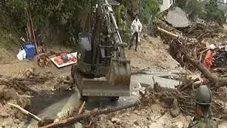 Raw: Rescue Efforts Suspended at Japan Landslide