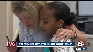 Girl survives battle with blinding brain tumor