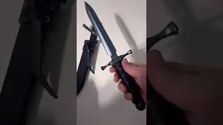 Hand crafted knife with blued blade.