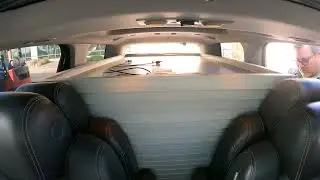 Squeezing 17th Solar Panel in 2014 GMC Acadia, Tying Down at SanTan Solar, Gilbert, Arizona NGH13493
