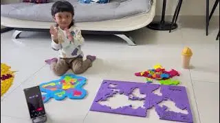 World map puzzle completion by toddler