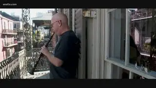 New Orleans musician Tim Laughlin serenades an empty Royal Street during COVID-19