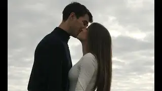 Couple holding hands and kissing