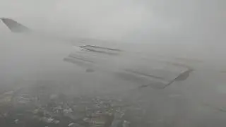 Qantas 747 landing in Sydney in bad weather QF064