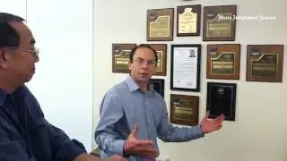 @marinij's Robert Sterling and Bob Tong decorate the IJ walls with our many awards. Way to go IJers!