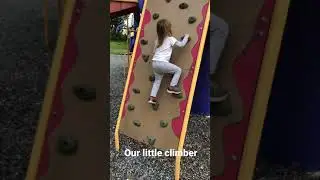 Mia climbing playground rock wall!