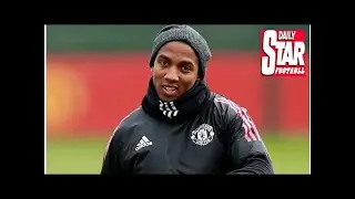 Manchester united take up option to extend ashley young's contract