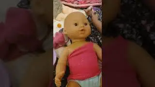 Feeding Harper peas Doll food