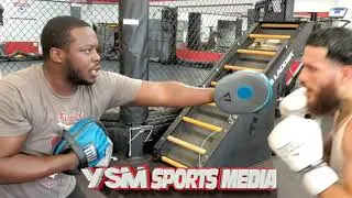 Joshafat Ortiz gets instruction from Greg Hackett 