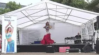 Sandy Maya performing with zills at Bastille Day Reading Fest 2019