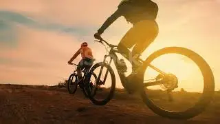 Cycling At Sunset Stock Video   Download Video Clip Now   iStock