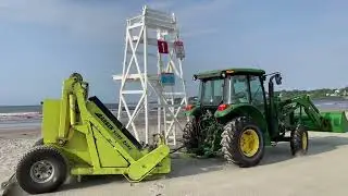 John Deere 5100E Tractor with a Barber Surf Rake Cleaning Easton&rsquo;s Beach