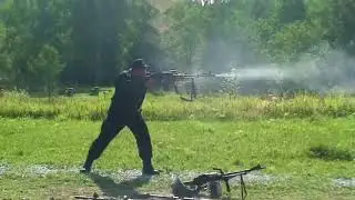 Slav firing light machine gun