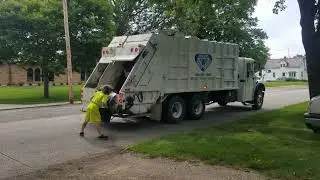 Absolute waste removal Freightliner split rear loader on manual recycle