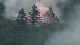 US battling almost 100 large, active wildfires