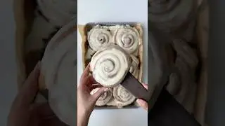 Cinnamon rolls with cinnamon sauce and vanilla icing.