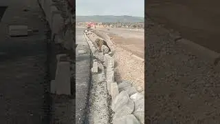 fixing of kerb stone along road for walkway