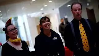 WINI Wonderland Carolers - Merry Voices singing at a promotional event.