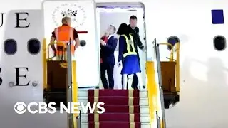 Watch: Emmanuel Macron's wife appears to shove him in the face