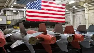Loading JDAM bombs onto a B-2 Stealth Bomber
