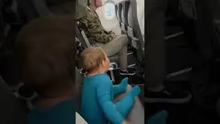 10-month-old delights passengers on delayed flight