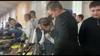 Russian Airborne Troops visiting a school show weapons to children...