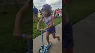 Riding her new Bluey scooter! She saved the money just to buy it!