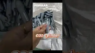 Workers are inspecting the quality of CO2 cylinders.