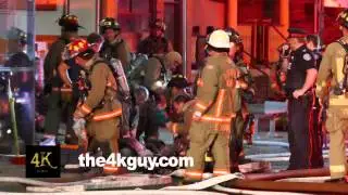 4K UHD - Group of firemen giving first aid and CPR to victim