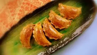 Chinese New Year sweet and flaky pastry with sesame, peanut and coconut (&lsquo;youjiao' 油角), baked