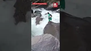 Fearless Health Worker Leaps Across Flooded Stream in Mandi