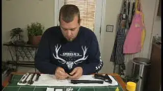 Wiping Down the Main Spring Housing of a Ruger Mark 2 Gun
