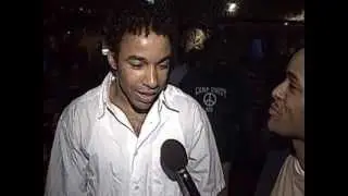 Shaquille O'Neal taps Allen Payne's backside during an interview with Tim Lampley