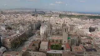 Beautiful aerial footage of historic district of metropolis. Fly around gothic Cathedral of