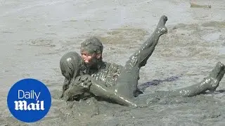 Mud-theme carnival party takes places in Brazil's Paraty - Daily Mail