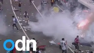 Hong Kong police disperse pro-democracy protests with tear gas
