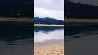 Relaxing time at a beautiful Delta with mountain reflections in Northern Spain