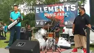 Chuckie Campbell performs on a stool at the Elementz Music Fest