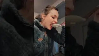 Woman Eating Hot Food Out Of Spatula Spoon And Then Spits It Out