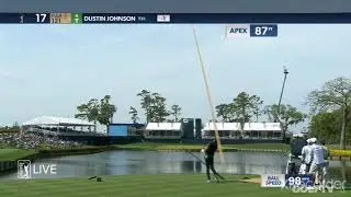 Dustin Johnson hits the flag on the 17th hole at the players 2021