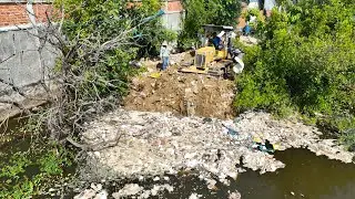 New Project In Village Using Small Bulldozer Pushing Trash With Small Dump Trucks