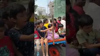 KIDS ENJOYING BULLOCK CART RIDE AT APPARTMENT PREMISES ON SANKRANTI DAY