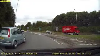 YD54 XCC Takes left lane for 3rd exit and then STOPS on exit nearly causing an accident