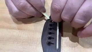 Intasound demonstrate how to re-string an acoustic guitar
