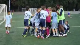 -old SKC Academy U14s celebrating after winning PK