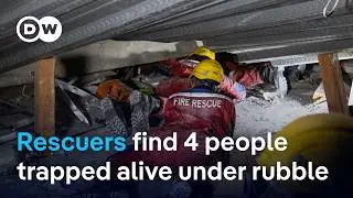 Rescuers race to free 4 people still alive under rubble of collapsed school in Indonesia | DW News